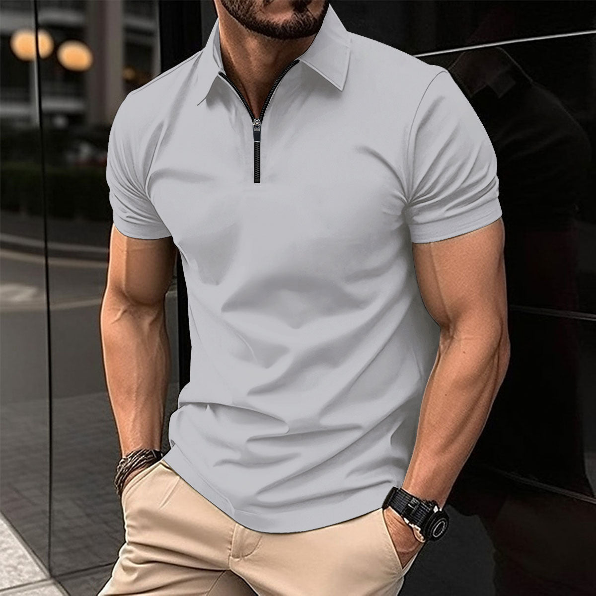 Polo deportivo de color liso con cremallera para hombre.
