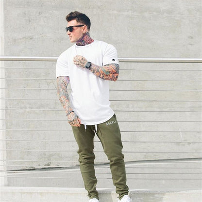 Muscle Master Herren-Rundhals-T-Shirt mit kurzen Ärmeln, zum Sport und Laufen, mit geschwungenem Saumdesign